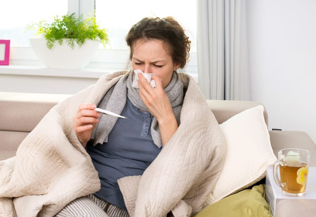 Woman-with-Thermometer-sick-with-flu--1024x704